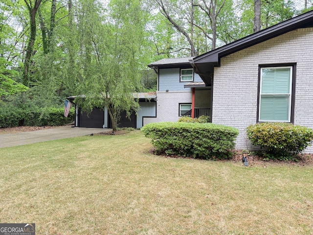 3629 Embry Cir, Atlanta, GA 30341 - exterior space featuring a garage, driveway, a front yard, and brick siding