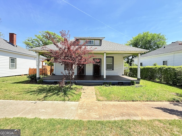 30 Poplar St, Porterdale, GA 30014 - bungalow-style house featuring roof with shingles, a front yard, and covered porch
