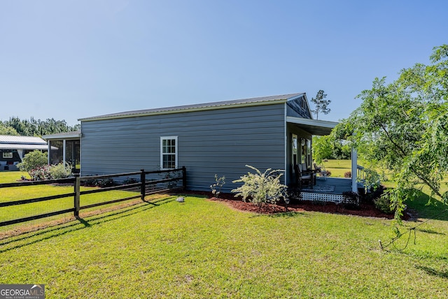 3636 Echols St, Patterson, GA 31557 - view of side of home featuring a lawn and fence
