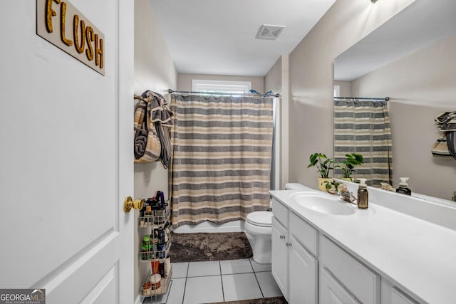 bathroom with tile patterned flooring, toilet, vanity, and curtained shower