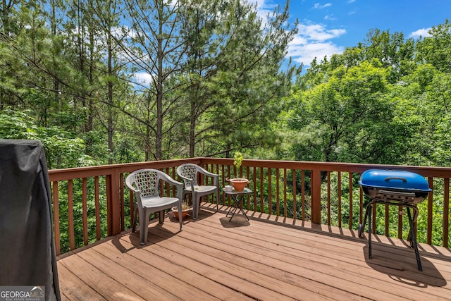 wooden terrace featuring area for grilling