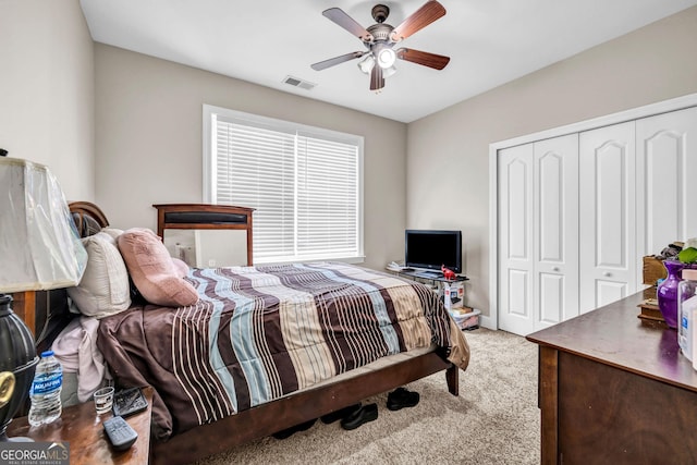 bedroom featuring carpet floors, a closet, and ceiling fan