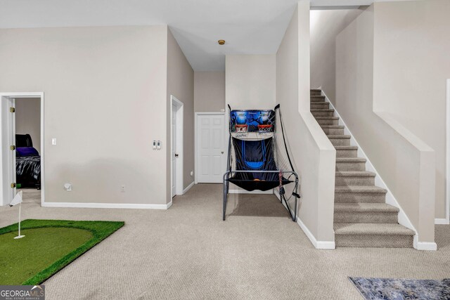 stairs featuring carpet and baseboards