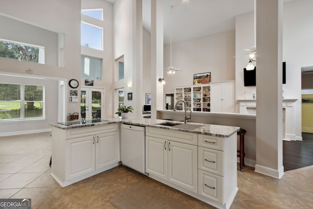 547 E Cardinal Cir, Saint Marys, GA 31558 - kitchen with light tile patterned floors, a high ceiling, dishwasher, a sink, and ceiling fan