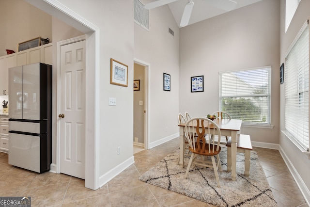 547 E Cardinal Cir, Saint Marys, GA 31558 - dining area featuring visible vents, baseboards, light tile patterned flooring, and a towering ceiling