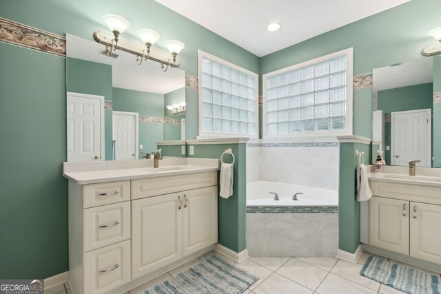 547 E Cardinal Cir, Saint Marys, GA 31558 - full bathroom with an inviting chandelier, two vanities, a bath, and a sink