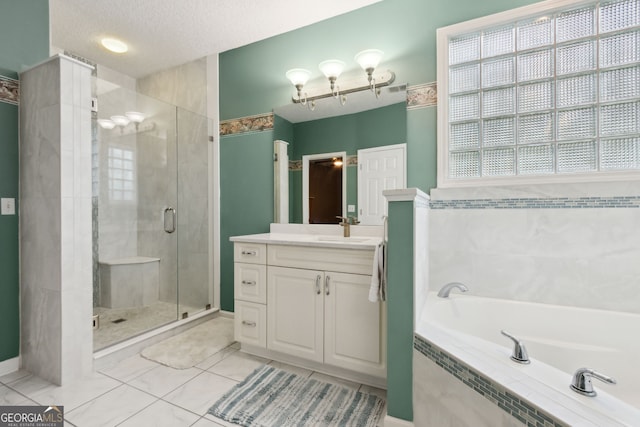 547 E Cardinal Cir, Saint Marys, GA 31558 - full bathroom featuring a shower stall, a bath, a textured ceiling, vanity, and visible vents