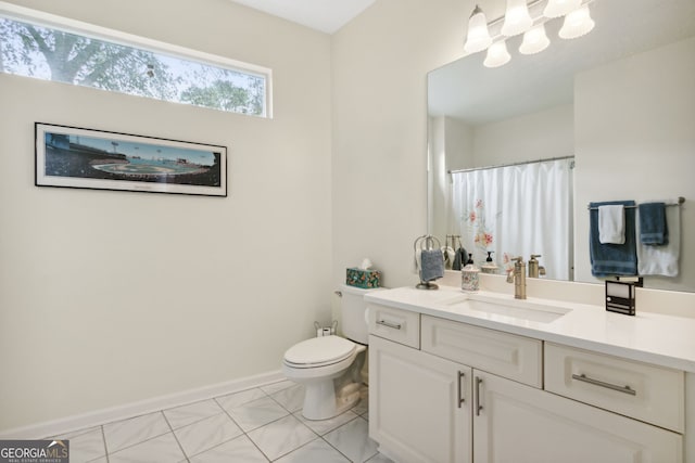 547 E Cardinal Cir, Saint Marys, GA 31558 - bathroom with baseboards, a shower with shower curtain, toilet, vanity, and tile patterned floors