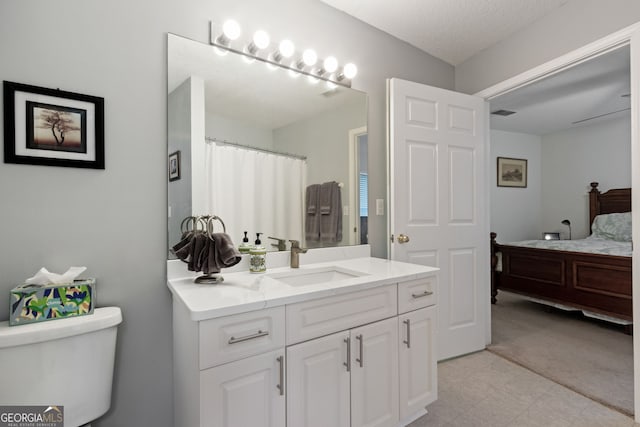 547 E Cardinal Cir, Saint Marys, GA 31558 - bathroom with toilet, vanity, and a shower with curtain
