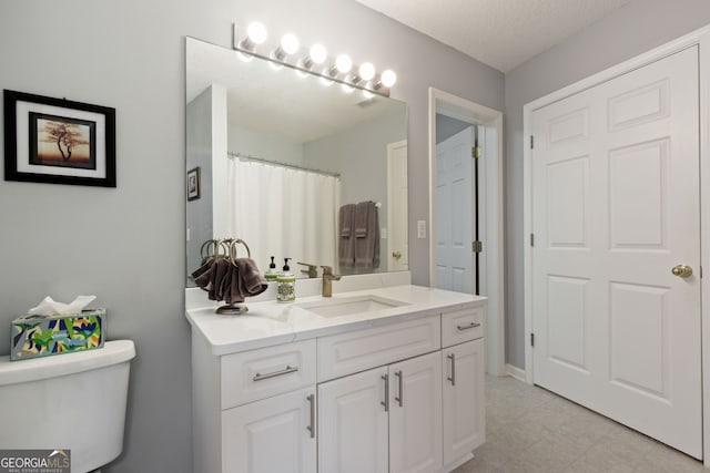 547 E Cardinal Cir, Saint Marys, GA 31558 - bathroom with toilet, vanity, and tile patterned floors