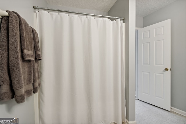 547 E Cardinal Cir, Saint Marys, GA 31558 - full bath featuring a textured ceiling, tile patterned flooring, and baseboards