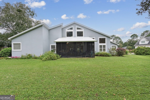 547 E Cardinal Cir, Saint Marys, GA 31558 - rear view of house with a lawn, a sunroom, and stucco siding
