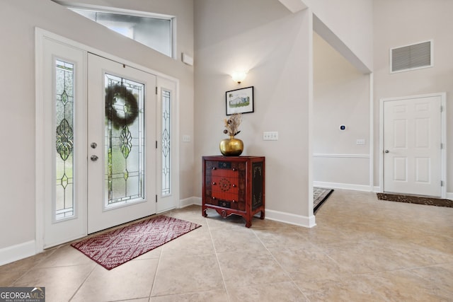 547 E Cardinal Cir, Saint Marys, GA 31558 - entrance foyer featuring baseboards, light tile patterned floors, a towering ceiling, and visible vents