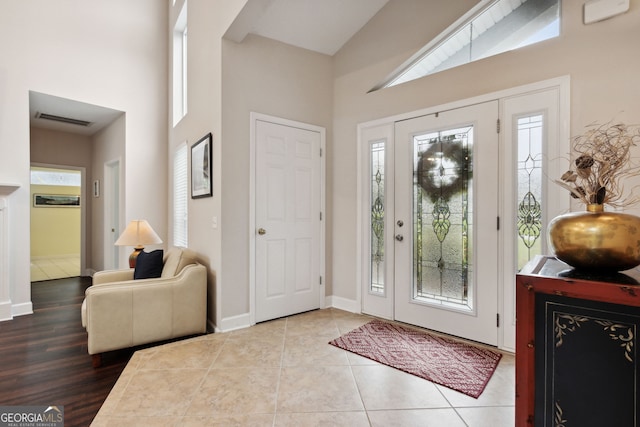 547 E Cardinal Cir, Saint Marys, GA 31558 - entryway featuring visible vents, baseboards, and a towering ceiling