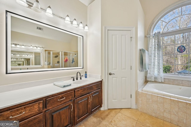 full bath with visible vents, tile patterned flooring, a healthy amount of sunlight, and a stall shower