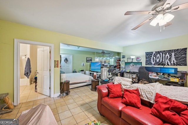 living area with tile patterned flooring and a ceiling fan