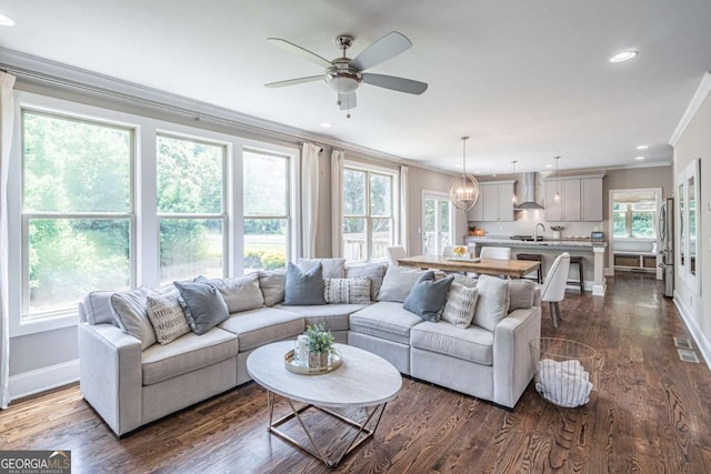 2675 Sugar Mill Dr, Atlanta, GA 30316 - living area with crown molding, baseboards, dark wood-style floors, recessed lighting, and a ceiling fan