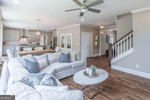 2675 Sugar Mill Dr, Atlanta, GA 30316 - living area with crown molding, recessed lighting, dark wood finished floors, and ceiling fan with notable chandelier