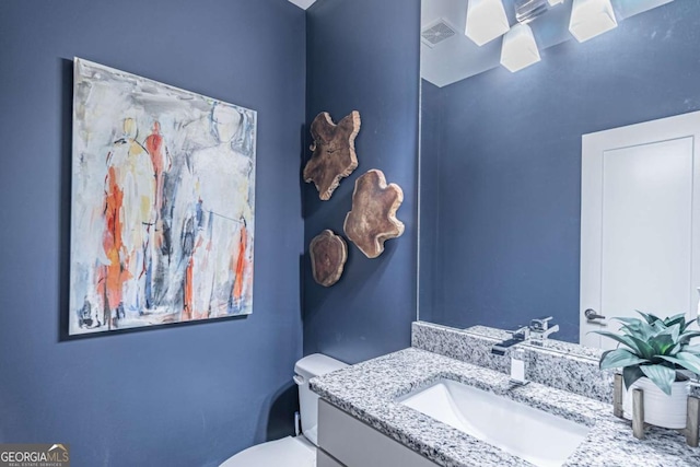 2675 Sugar Mill Dr, Atlanta, GA 30316 - bathroom with visible vents, toilet, and vanity