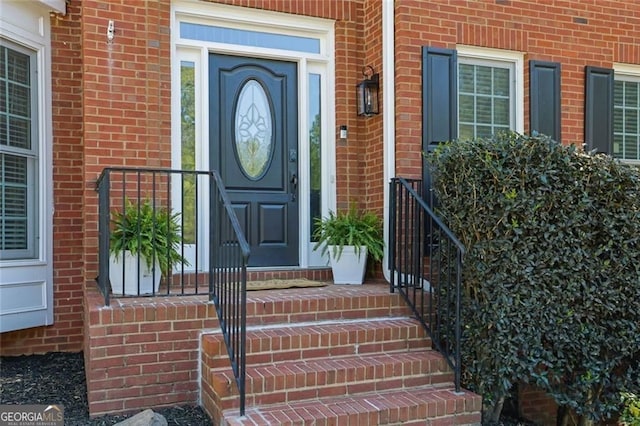 entrance to property with brick siding
