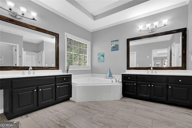 bathroom with two vanities, a garden tub, a sink, and ornamental molding