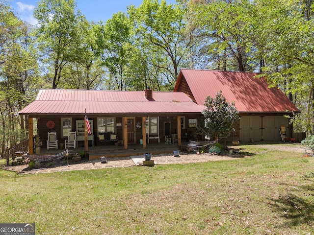 366 Crabapple Rdg, Clarkesville, GA 30523 - view of front of house featuring a porch, a front lawn, a chimney, and metal roof