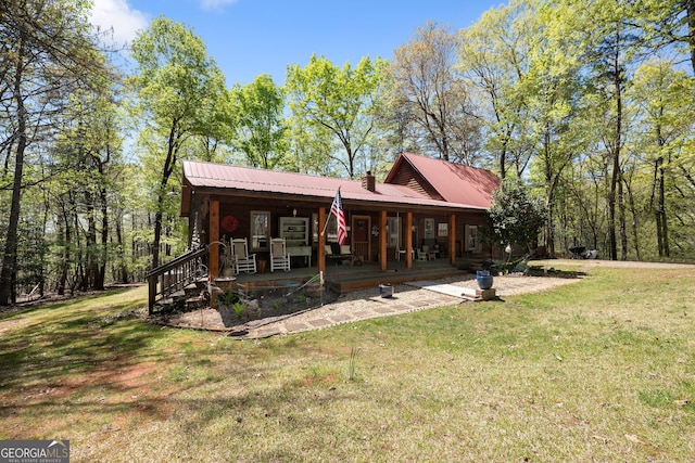 366 Crabapple Rdg, Clarkesville, GA 30523 - back of house featuring covered porch, a yard, and metal roof