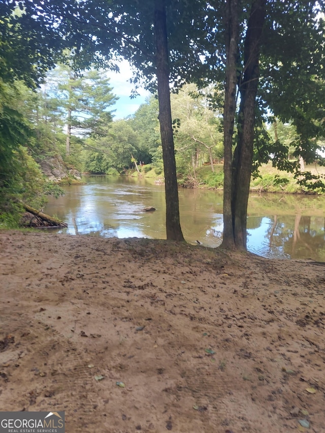 366 Crabapple Rdg, Clarkesville, GA 30523 - back of house with a lawn, a deck, central AC, and metal roof