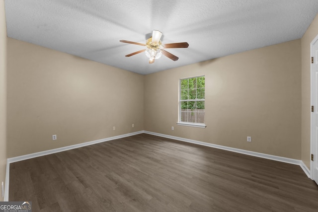 203 Old Pond Dr W, Kingsland, GA 31548 - spare room featuring ceiling fan, dark wood-type flooring, baseboards, and a textured ceiling