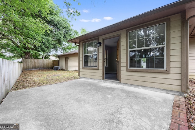 203 Old Pond Dr W, Kingsland, GA 31548 - view of patio featuring a fenced backyard and central AC unit