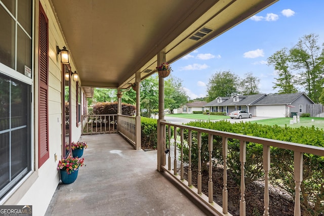 203 Old Pond Dr W, Kingsland, GA 31548 - balcony featuring covered porch and a residential view