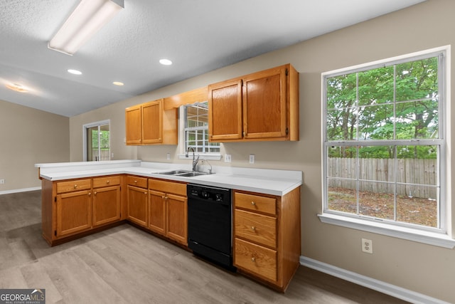 203 Old Pond Dr W, Kingsland, GA 31548 - kitchen featuring black dishwasher, a sink, a peninsula, light wood-style floors, and recessed lighting