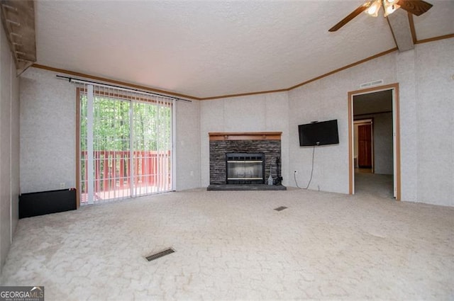 1530 Mcbrayer, Temple, GA 30179 - unfurnished living room featuring vaulted ceiling, carpet flooring, ceiling fan, a textured ceiling, and a stone fireplace