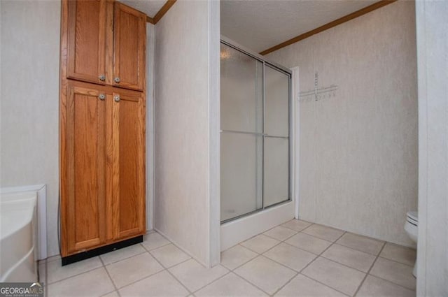 1530 Mcbrayer, Temple, GA 30179 - full bathroom featuring ornamental molding, toilet, a shower with door, a tub to relax in, and tile patterned flooring