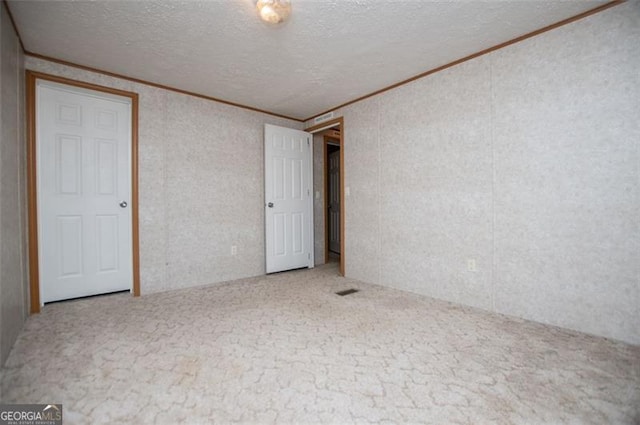 1530 Mcbrayer, Temple, GA 30179 - carpeted spare room with ornamental molding and a textured ceiling