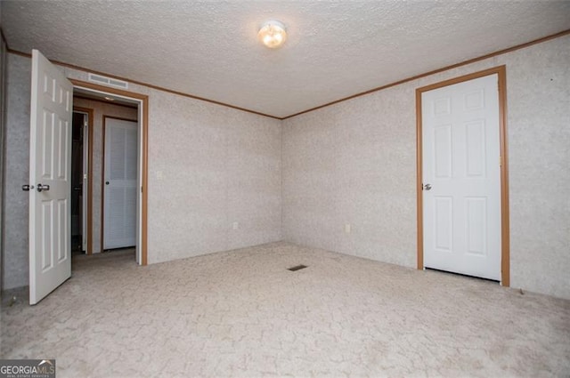 1530 Mcbrayer, Temple, GA 30179 - carpeted spare room featuring crown molding and a textured ceiling