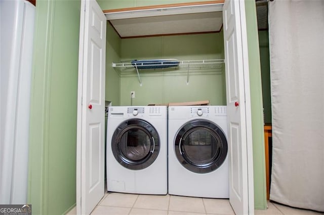 1530 Mcbrayer, Temple, GA 30179 - washroom with washer and clothes dryer and light tile patterned flooring