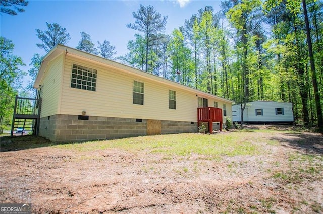 1530 Mcbrayer, Temple, GA 30179 - back of property with crawl space and a deck
