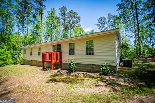 1530 Mcbrayer, Temple, GA 30179 - back of property featuring crawl space, a lawn, central AC unit, and a deck