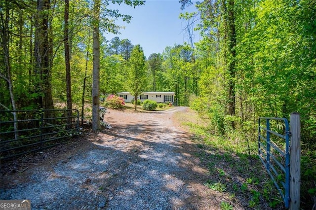 1530 Mcbrayer, Temple, GA 30179 - view of dirt / gravel road with a wooded view