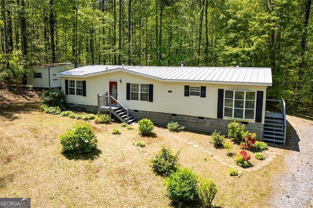 1530 Mcbrayer, Temple, GA 30179 - manufactured / mobile home featuring crawl space, metal roof, and a view of trees