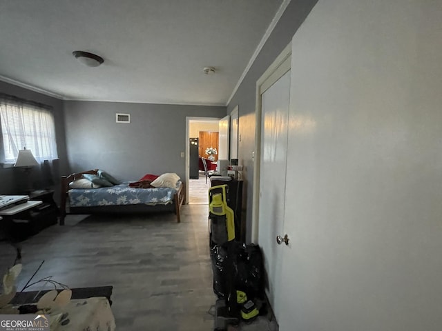 1105 College St, Bainbridge, GA 39819 - bedroom with crown molding and visible vents