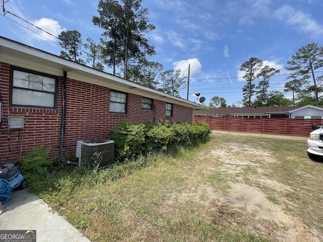 1105 College St, Bainbridge, GA 39819 - view of yard with fence and central AC unit