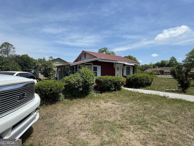 1105 College St, Bainbridge, GA 39819 - view of front facade with metal roof