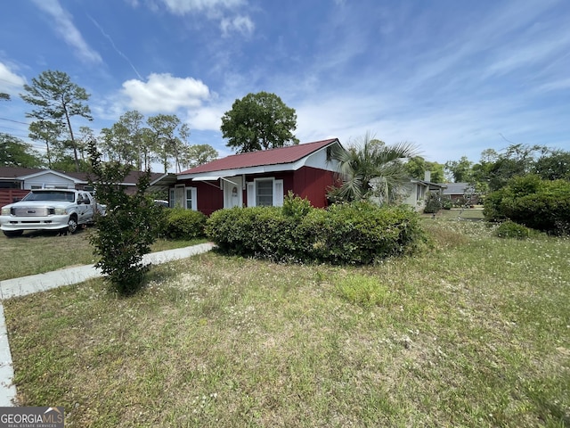 1105 College St, Bainbridge, GA 39819 - ranch-style home featuring metal roof