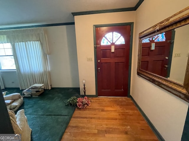 1105 College St, Bainbridge, GA 39819 - entrance foyer with crown molding and wood finished floors