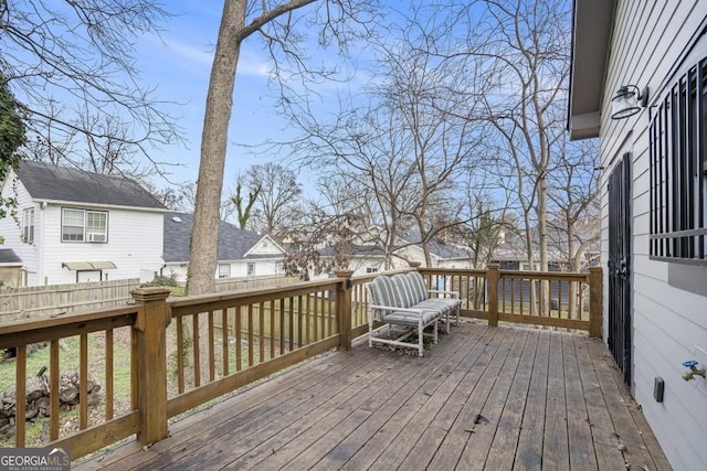 wooden deck with fence and a residential view