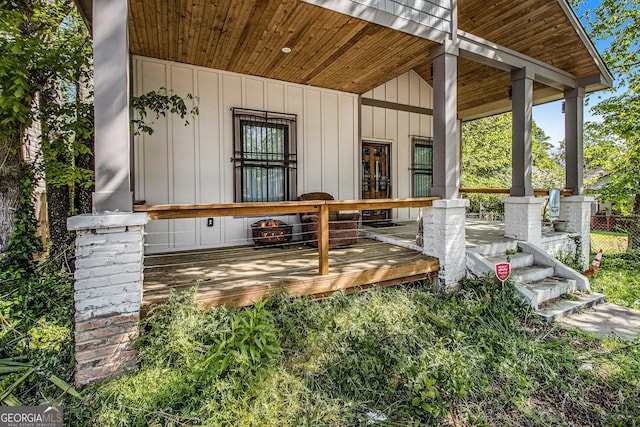 exterior space with board and batten siding and a porch