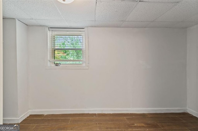 3501 Wesley Chapel Rd, Decatur, GA 30034 - empty room with wood finished floors, baseboards, and a paneled ceiling