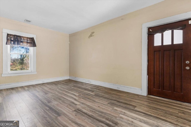 602 W Lake Ave NW, Atlanta, GA 30318 - entrance foyer with wood finished floors, a healthy amount of sunlight, and visible vents